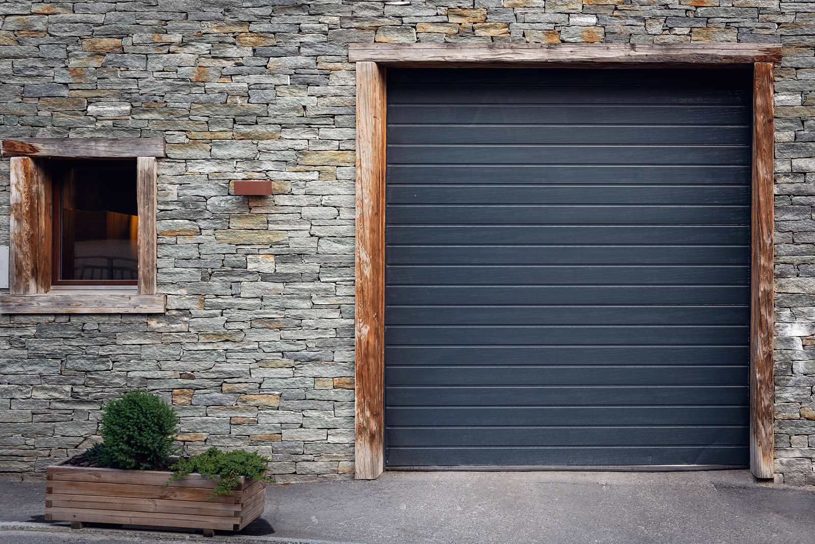 Front View of Shutter Door and Window With Tile Stone Background